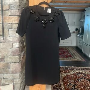 April Morin, black mini dress with bejeweled neck line, size M